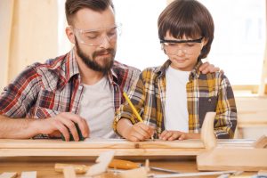 Father and Son Working on a Carpentry Project
